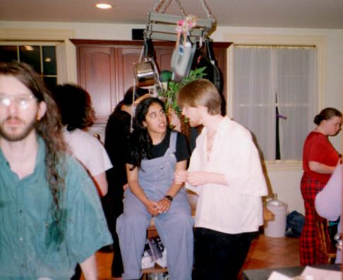 Barbie hangs out over the mob in the kitchen.